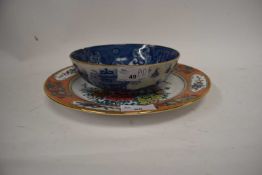 A group of ceramics comprising a pearlware bowl, a miniature Chinese jar and cover decorated with