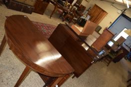 Large 19th century mahogany dining table comprising two D-end sections, a central drop leaf