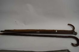 FOUR MIXED WALKING STICKS