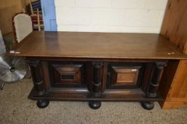 18th century and later oak Continental sideboard with two panelled doors, stylised Corinthian column