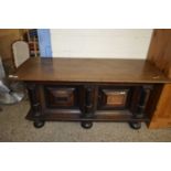 18th century and later oak Continental sideboard with two panelled doors, stylised Corinthian column