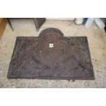 CAST IRON FIRE BACK WITH HERALDIC DECORATION, 77CM WIDE