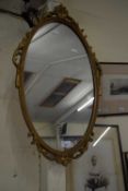 20TH CENTURY OVAL WALL MIRROR IN GILT EFFECT FRAME