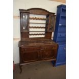 EARLY 20TH CENTURY OAK DRESSER, THE TOP SECTION WITH TWO LEAD GLAZED DOORS OVER A BASE WITH TWO