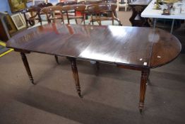 William IV or early Victorian mahogany drop leaf and extending dining table with three additional