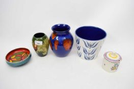 Group of Studio pottery wares including Poole vases and Moorcroft vase with tube lined flowers on