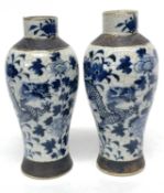 Pair of Chinese crackle ware vases, both with blue and white painted designs of dragons