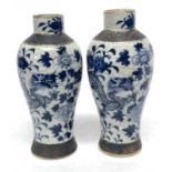 Pair of Chinese crackle ware vases, both with blue and white painted designs of dragons