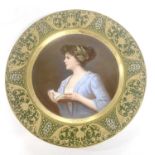 A Vienna style plate, the centre painted with ladies surrounded by a gilt and green designhairline