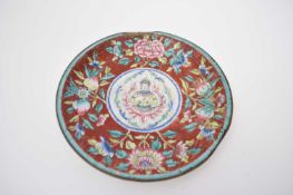 Chinese enamel plate, the centre decorated with a deity surrounded by peaches and floral design