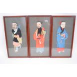 Three framed pictures of Chinese characters in fabric or silk, all in wooden frames, 40cm x 20cm (