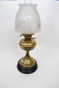Brass oil lamp with shade of floral design