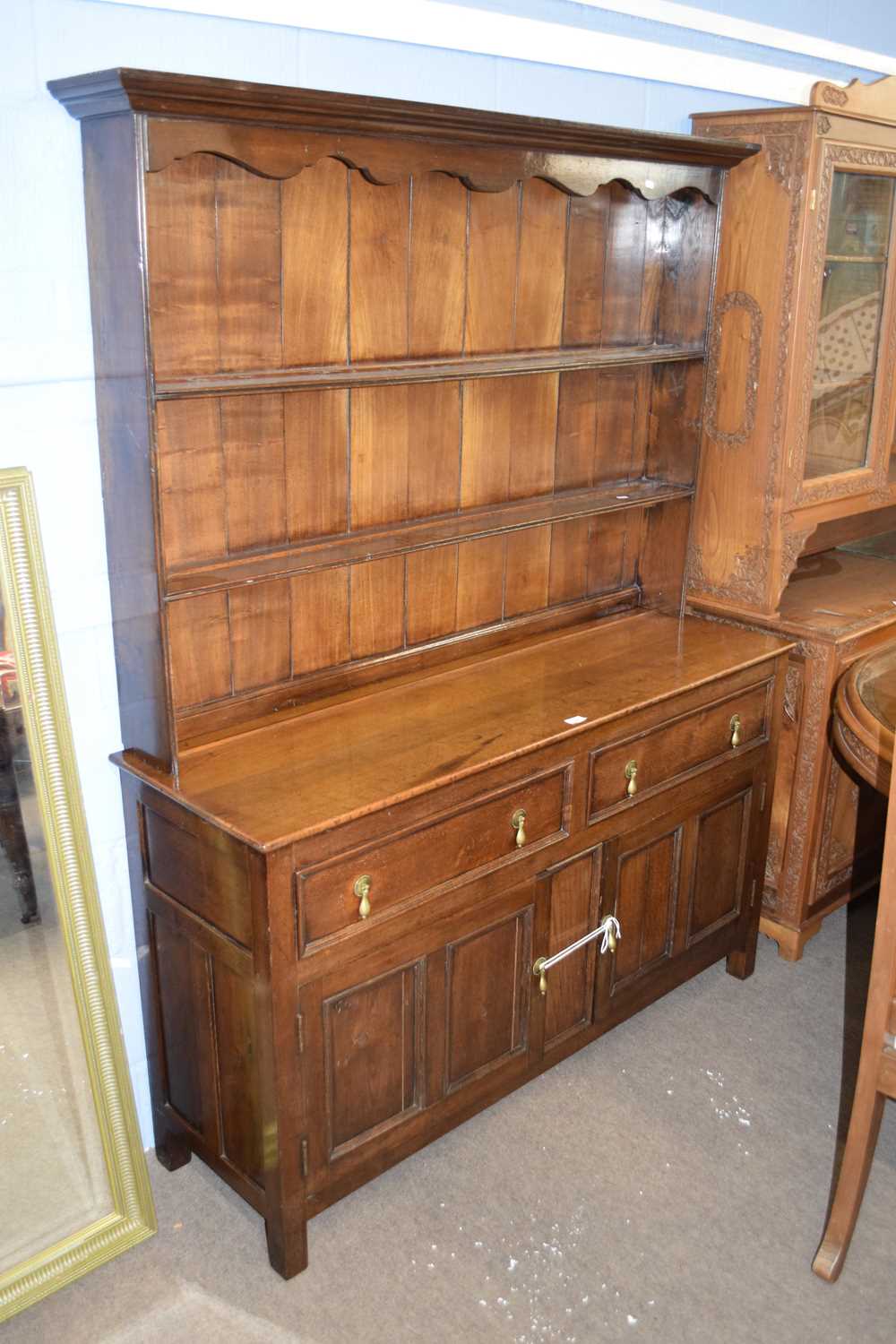 18th century style oak dresser with two shelves back over a base with two drawers and two panelled
