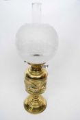 Brass lamp with floral design to shade