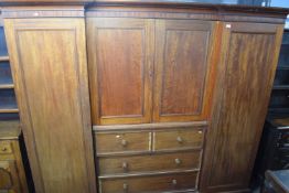 Large Victorian break front wardrobe, the centre section with two panelled doors over four drawers