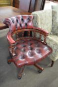20th century oxblood leather upholstered buttoned revolving office chair