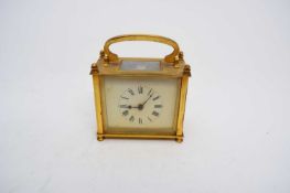 Early 20th century brass mantel clock with inscription verso