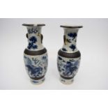 Pair of Chinese porcelain crackle ware vases, the ground decorated in blue and white with dragons (