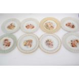 Quantity of Continental porcelain plates, all with printed designs of cherubs within pierced borders