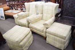 Pair of early 20th century wing back armchairs upholstered in a pale tartan fabric, together with