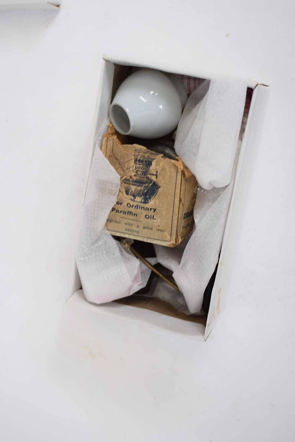 Small box containing a paraffin oil lamp with small glass shade and fittings
