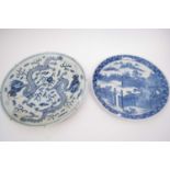 Two Oriental chargers, both with blue and white designs including one with dragons chasing the