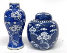 Small Chinese porcelain vase, the blue ground with prunus decoration together with a further Chinese