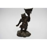 Chinese bronze of a mythical figure holding a cauldron aloft23cm high