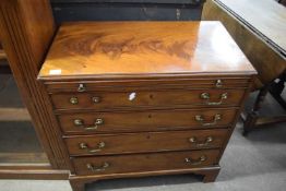 George III mahogany bachelor's chest with pull out brushing slide over four graduated drawers raised