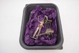 Small box containing two metal tribal or ethnic figures