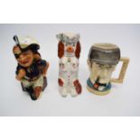 Two character jugs and a Staffordshire style reproduction dog (3)