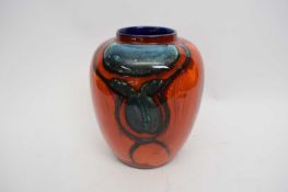 Poole Pottery vase, the red ground with grey blue decoration, 24cm high