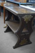 Hardwood Zanzibar two-tier table with applied brass and stud work detail, 76cm wide