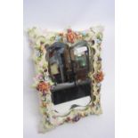 Late 19th century Continental porcelain mirror, the frame with applied flowers