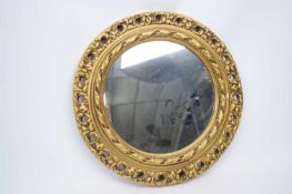 Circular wall mirror with wooden gilt style frame