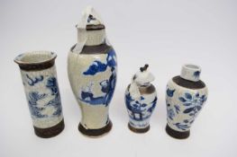 Group of four crackle ware vases, all with typical blue and white designs