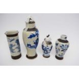 Group of four crackle ware vases, all with typical blue and white designs