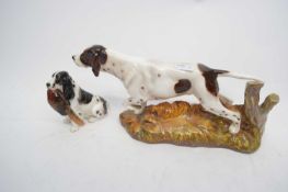 Royal Doulton model of a retriever and one of a spaniel with pheasant in its mouth (2)