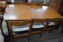 Mid-century retro teak rectangular extending dining table together with a set of six accompanying