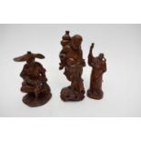 Group of three Chinese carved wooden figures of deities