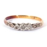 Three stone diamond ring featuring three small single cut diamonds in illusion settings, stamped