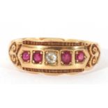 18ct gold ruby and diamond five stone ring centring an old cut diamond and four small graduated