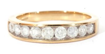 Modern 9ct gold and diamond half hoop ring featuring nine graduated round brilliant cut diamonds,