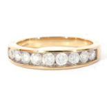 Modern 9ct gold and diamond half hoop ring featuring nine graduated round brilliant cut diamonds,