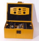 Yellow leatherette jewellery box with initials 'ED' on lid, to include various costume necklaces,