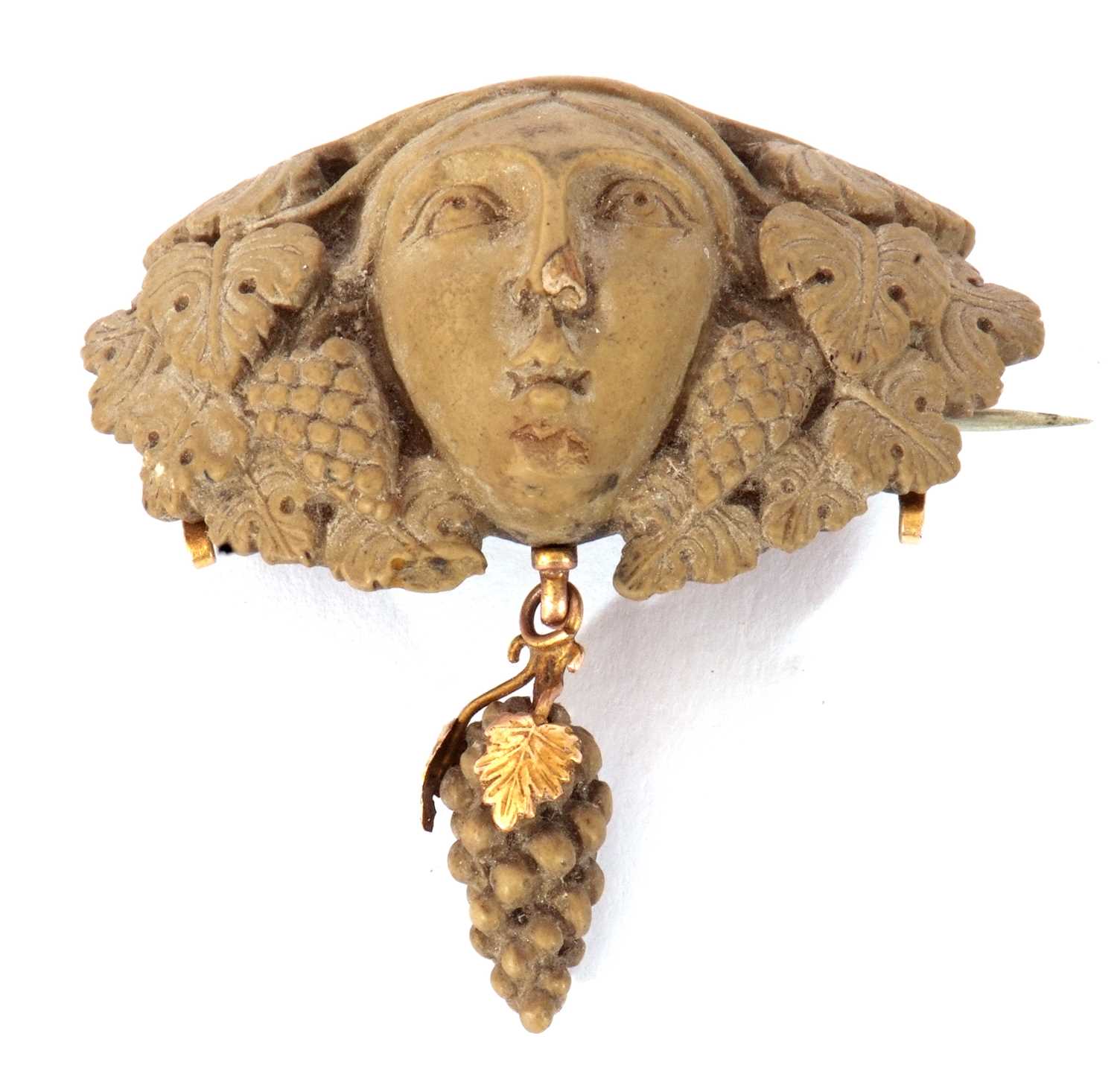 Antique lava brooch in relief a head between vine leaves with a bunch of grapes dropper below, 5cm - Image 2 of 3