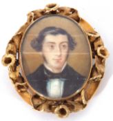 Antique miniature oval brooch, hand painted with head and shoulders portrait of a gentleman, in a