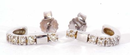 Pair of diamond set half hoop earrings, each set with five small single cut diamonds, post fittings,