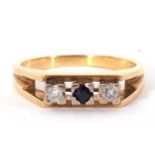 18ct gold sapphire and diamond ring centring a small round cut sapphire, flanked by two small