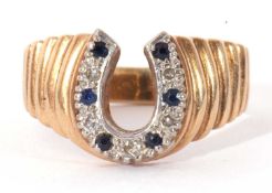 9ct gold diamond and sapphire horseshoe ring, the horseshoe alternate set with small diamonds and